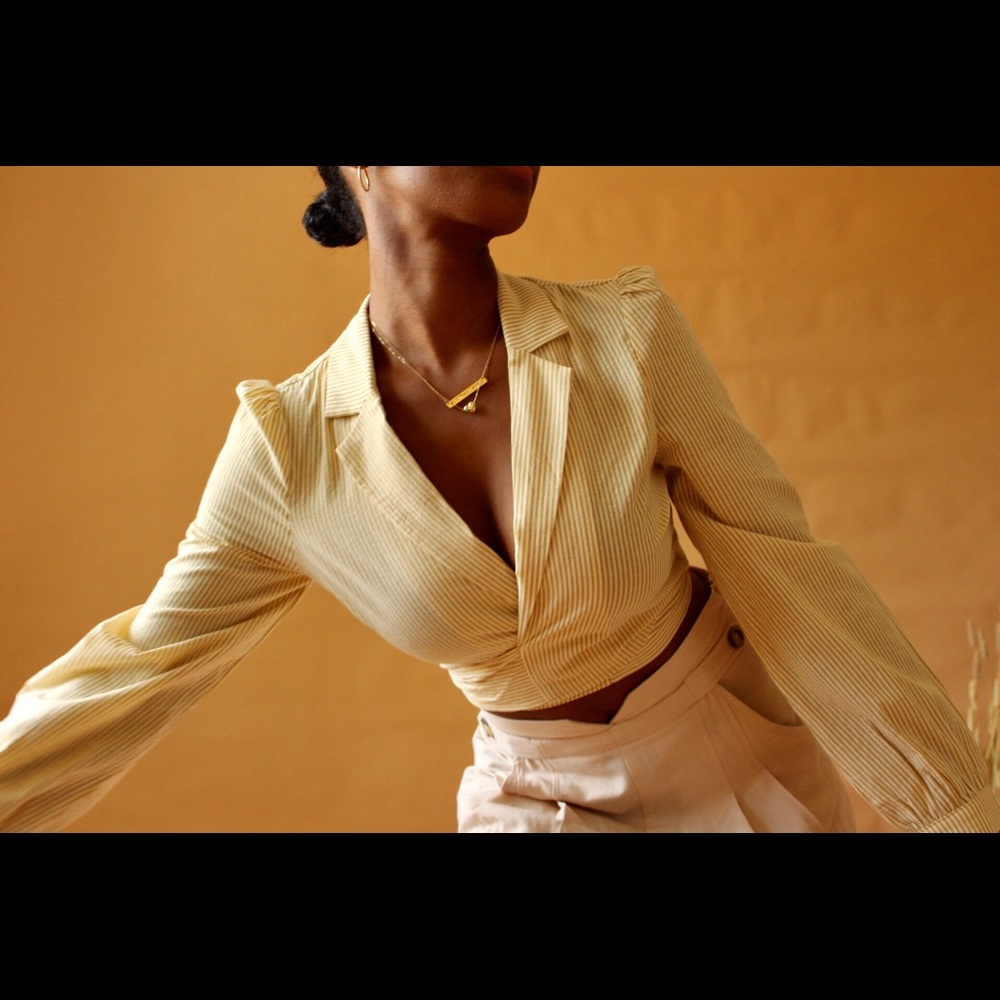 Yellow top perfect with a skirt or jean.